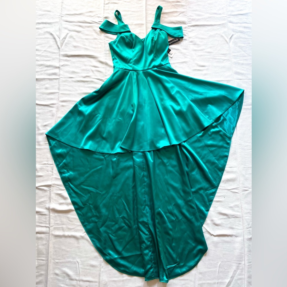 Sequin Hearts. Brand new emerald sequin dress with a tail.